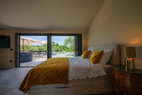 Postel nebo postele na pokoji v ubytování Villa Bartolo Rovinj