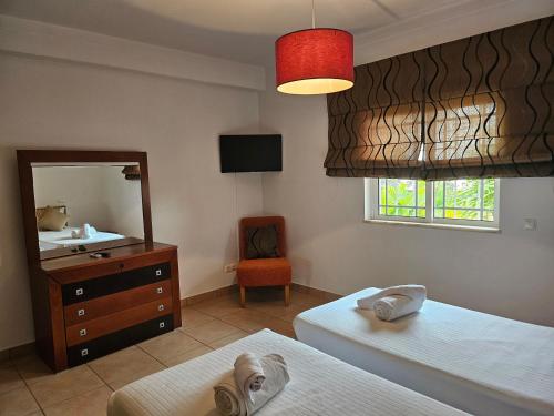 Katil atau katil-katil dalam bilik di Vila das Pétalas by Atlantichotels