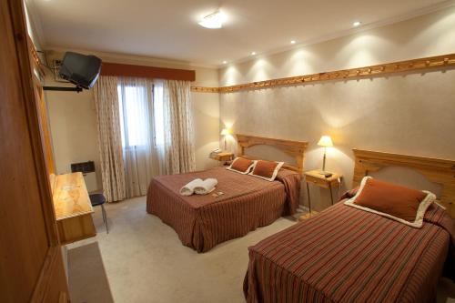 Кровать или кровати в номере Hotel " Rio Grande "
