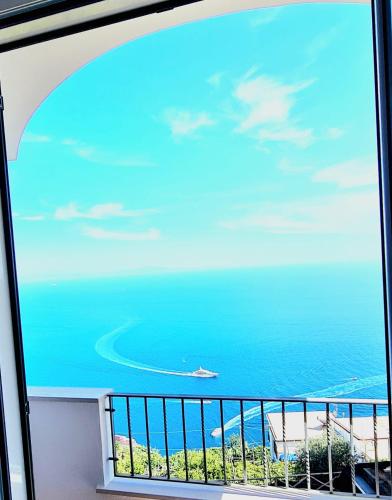 a view of the ocean from a balcony at Villa Blu Costiera in Amalfi