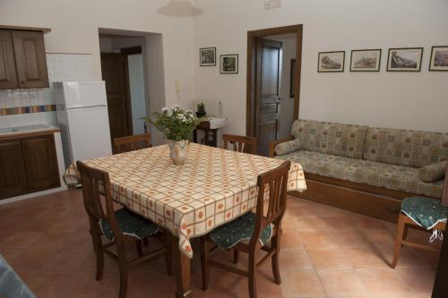 a living room with a table and a couch at Casa Lippi in Casal Velino