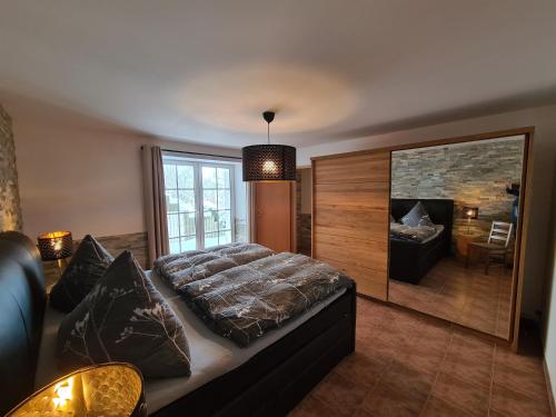 a bedroom with a large bed and a fireplace at Ferienwohnung Altstadt in Annaberg-Buchholz