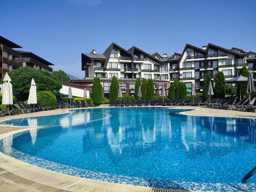 a large swimming pool in front of a building at F307 Studio Aspen Golf Resort Bansko in Bansko