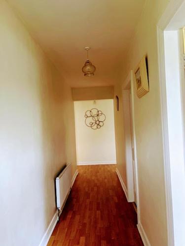 an empty hallway with a room with a television at House in the heart of the village in Glencolumbkille