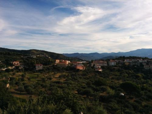 a town on a hill with mountains in the background at Casa Lippi in Casal Velino