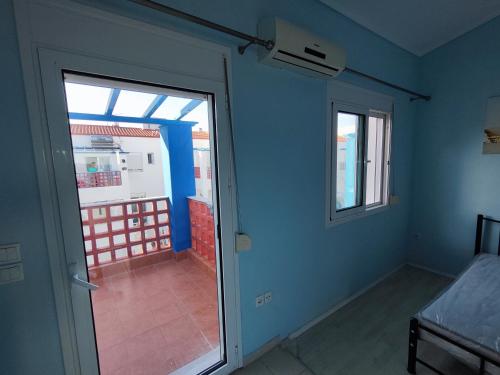 an empty room with a door and a window at Seaside house in Sozopoli