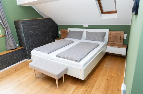 a large bed in a room with green walls at Ferienwohnung Mosel-Saar-Ruwer in Bernkastel-Kues