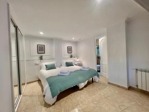 a bedroom with a large bed in a room at Balnea Baiona in Baiona