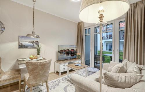 a living room with a couch and a table at Baltischer Hof Apartment 11 in Boltenhagen