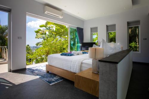 Ένα ή περισσότερα κρεβάτια σε δωμάτιο στο Villa Beyond 9 Bedrooms Seaview - Full Services