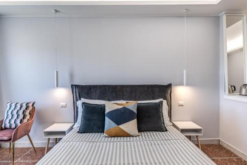 a bedroom with a large bed with pillows at 3Storie Vatican St Peter in Rome
