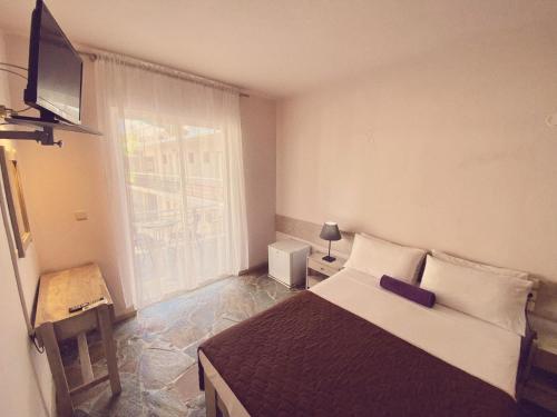 Postel nebo postele na pokoji v ubytování Ermis Hotels & Resorts