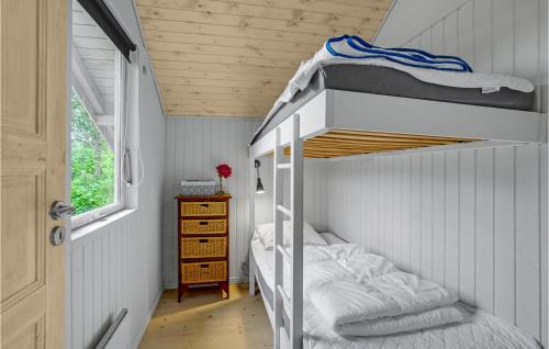 a small bedroom with a bunk bed in a house at 2 Bedroom Awesome Home In Nakskov in Nakskov