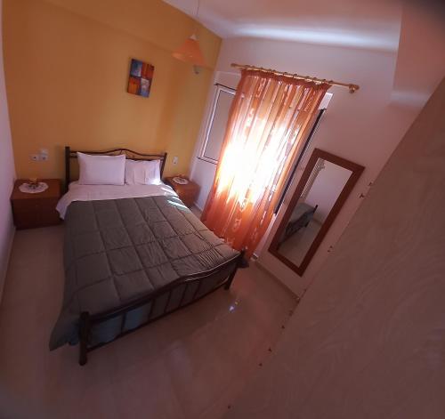 an overhead view of a bedroom with a bed and a window at Central Rooms in Makry Gialos