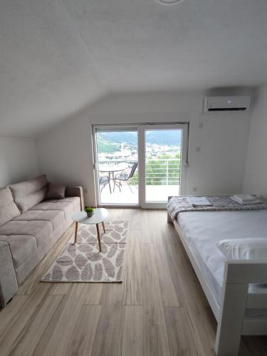 Ένα ή περισσότερα κρεβάτια σε δωμάτιο στο View of the city - Studio Apartment