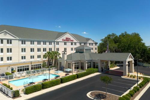 an image of a hotel with a pool at Hilton Garden Inn Gainesville in Gainesville