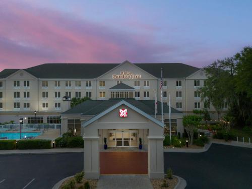 a hotel with a sign on the front of it at Hilton Garden Inn Gainesville in Gainesville