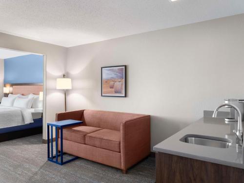 a room with a couch and a sink and a bed at Hampton Inn Ottawa - Starved Rock Area in Ottawa