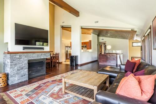 a living room with a couch and a fireplace at Snowcreek V 731 in Mammoth Lakes