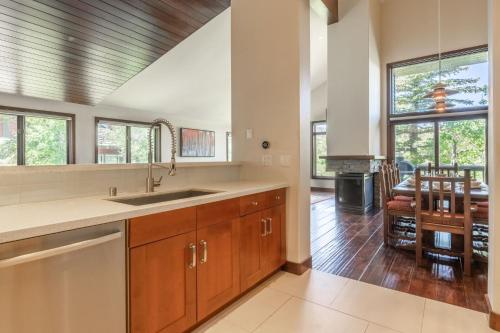 a kitchen with a sink and a dining room at Snowcreek V 731 in Mammoth Lakes