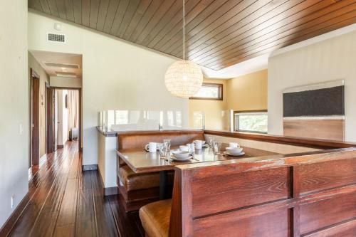 a dining room with a table and a chandelier at Snowcreek V 731 in Mammoth Lakes