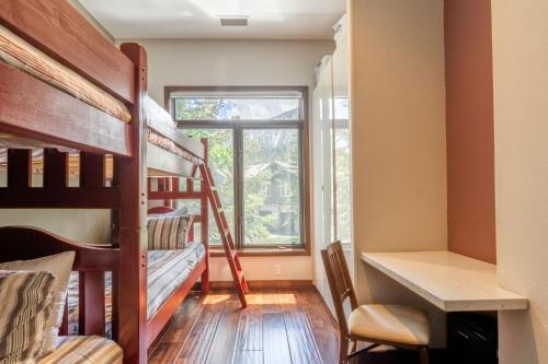 a dorm room with a desk and bunk beds at Snowcreek V 731 in Mammoth Lakes