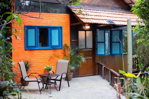 a house with a table and chairs in front of it at The Dusun in Seremban