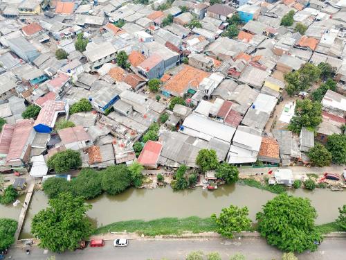 an aerial view of a city with a river at Modern and Nice 2BR at Patraland Urbano Apartment By Travelio in Bekasi