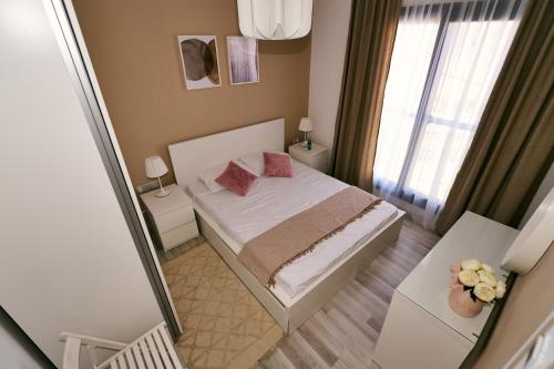 Postel nebo postele na pokoji v ubytování Caesar Blue комплекс
