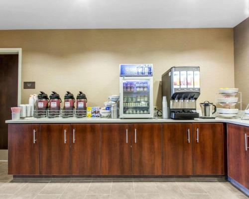a counter with a drink dispenser on top of it at Comfort Suites-Youngstown North in Youngstown