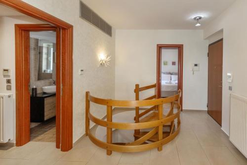 a room with a bathroom with a toilet and a sink at Holiday Maisonette in Varkiza by GHH in Vari