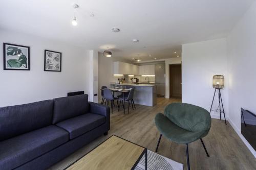 a living room with a couch and a table at Lovely 2 Bedroom Apartment in Central Ashford in Ashford