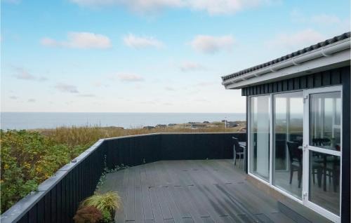 a balcony with a view of the ocean at Holiday Home Klitbakkevej in Lønstrup