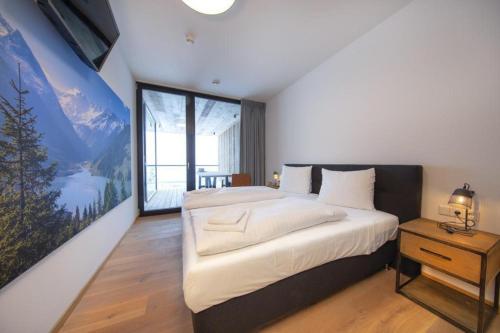Giường trong phòng chung tại Edelweisshaus Top 7