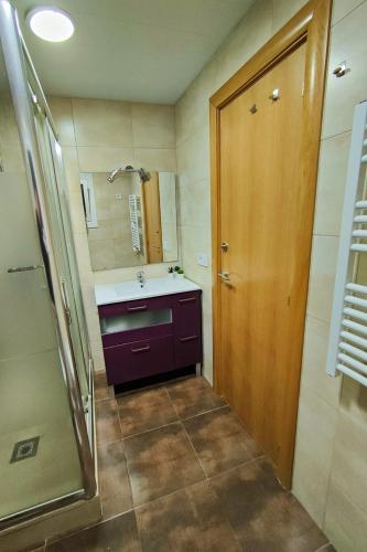 a bathroom with a sink and a shower at Apart Granollers Centre in Granollers