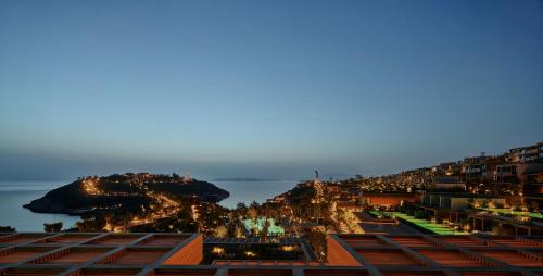 a view of a city with the ocean in the background at Maxx Royal Bodrum in Bodrum City