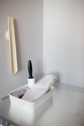 a white toilet sitting on top of a counter at Apart Hotel Acropolis in Odesa