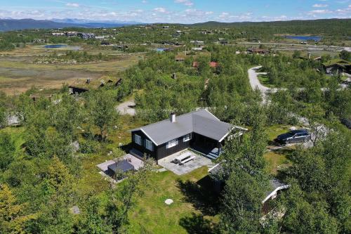 an aerial view of a house in the woods at Cozy family friendly cabin at beautiful location! in Geilo