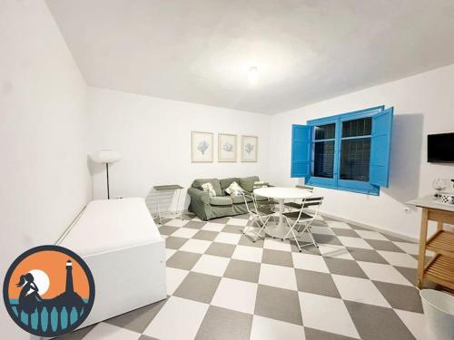 a living room with a checkered floor at Cala Micaela by Bossh! Apartments in Chipiona