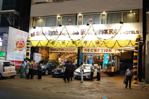 a group of people standing in front of a store at Sri Janakiram Hotels in Tirunelveli