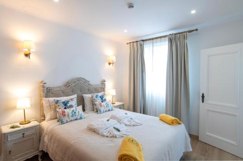 Ένα ή περισσότερα κρεβάτια σε δωμάτιο στο Aposento Real Villas