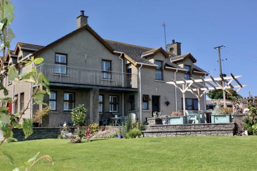 a large house with a lawn in front of it at Sutzus in Coleraine