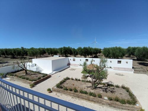 arial view of a compound with a fence and trees at Tenuta viale degli ulivi in San Martino in Pensilis