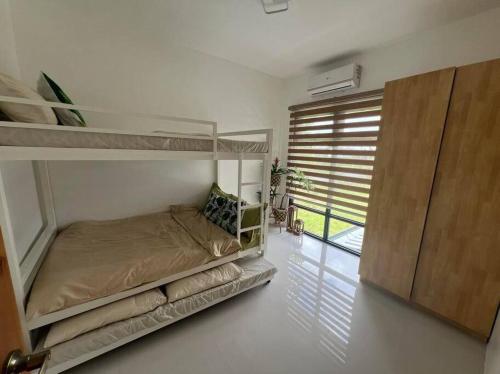 Ένα ή περισσότερα κρεβάτια σε δωμάτιο στο Serene Mia Casa