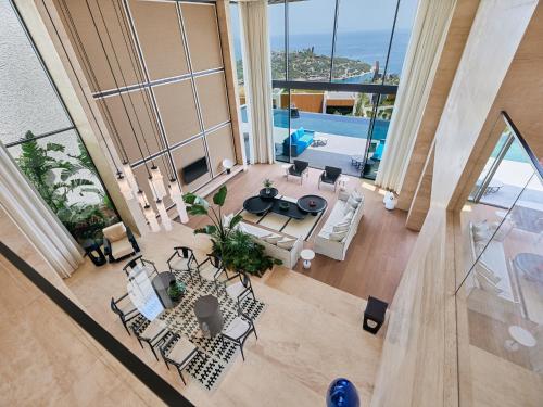 an overhead view of a living room with tables and chairs at Maxx Royal Bodrum in Bodrum City
