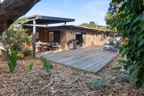 a wooden deck in front of a house at Brooks by the bay in Blairgowrie