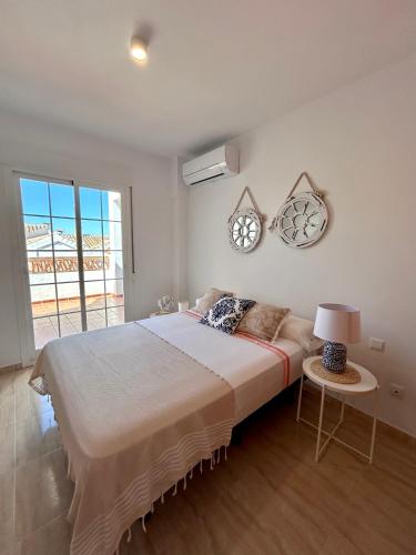 Postel nebo postele na pokoji v ubytování Apartamentos Pacifico