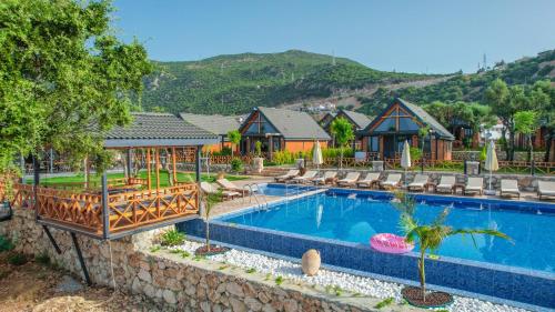 Bazén v ubytování Kaş Konak Bungalows nebo v jeho okolí