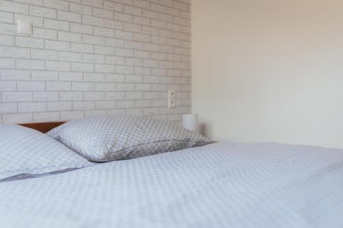 Ένα ή περισσότερα κρεβάτια σε δωμάτιο στο Apartmány Friends Liptov