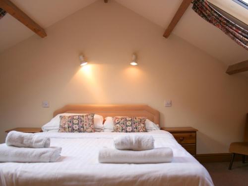 Postel nebo postele na pokoji v ubytování The Old Stables self catering